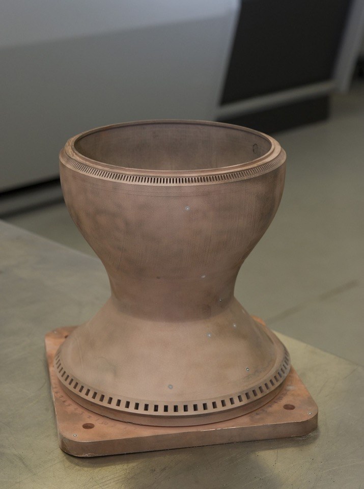 Metal additively manufactured copper chamber liner with integral cooling passages
